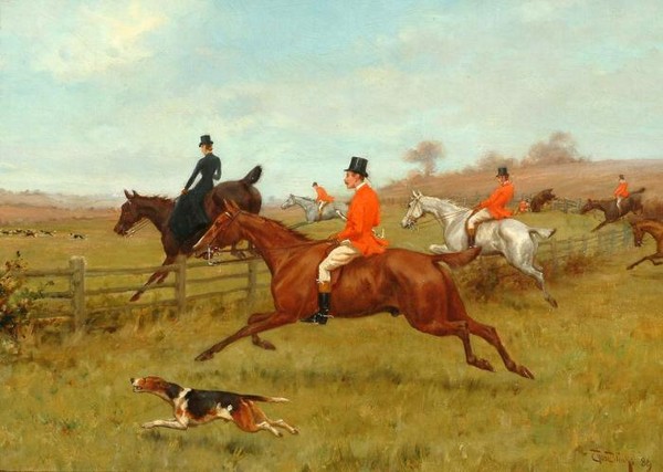 The chase the field taking a fence at the gallop